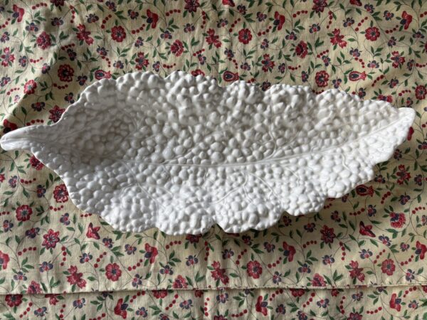 Old ceramic leaf serving dish with old staple repair
