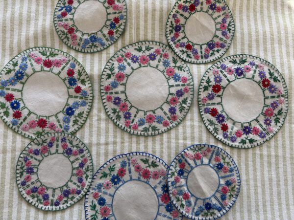 Set of vintage, hand embroidered place mats small and large