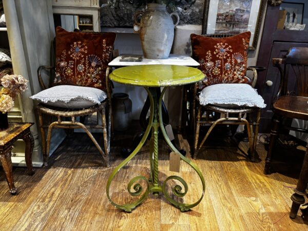 Old, wrought iron table with original moss green paint