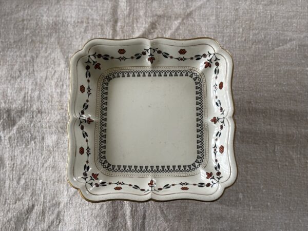 Antique footed plate