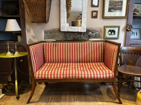 Edwardian, mahogany framed sofa with striped upholstery