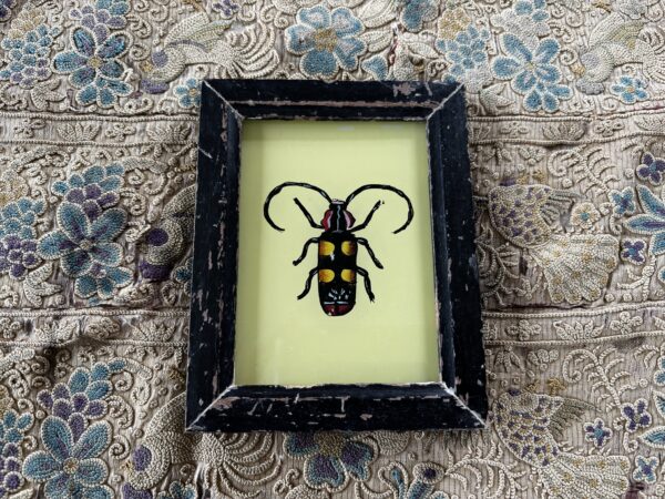 Reverse glass painting of a beetle