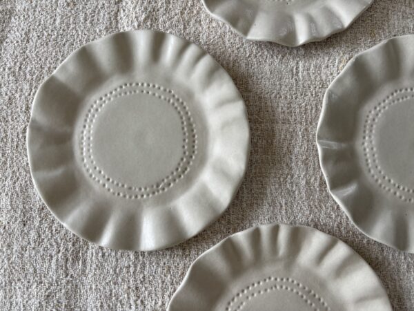 Small, stoneware, frilly plates